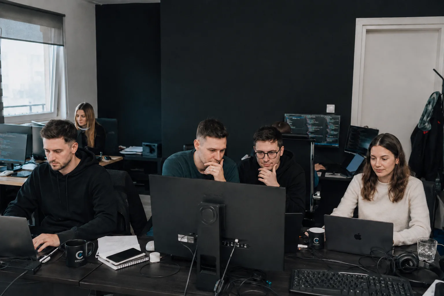 Cozaro Tech team working in the office